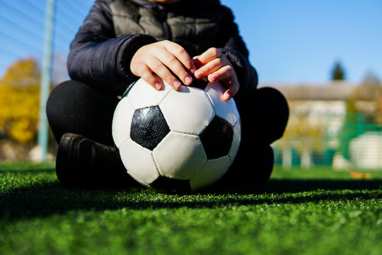 soccer ball in the hands of a child
