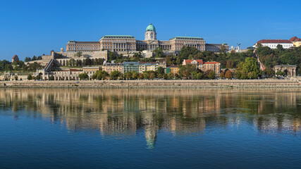 Budapest, Hungary. Castle Hill with Royal Palace, Castle Garden, Sandor Palace and Castle Hill Funicular. View from Danube in sunny autumn morning.