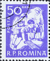 Romania - Circa 1960: a postage stamp printed in the Romania showing Playing children