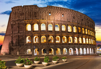 Roman Colosseum illuminated at sunset, Romw, Italy