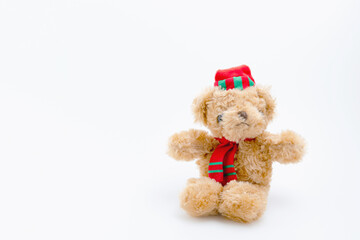 Single brown teddy bear sitting isolated on white background with copy space. The doll for children.