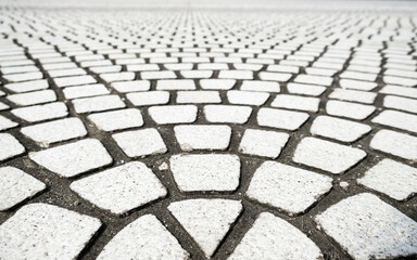 close up of pavement pattern made from rectangle stone bricks.
