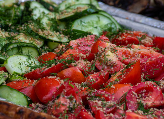 grilled sausages, vegetables, salads on the counter in the food court. street food