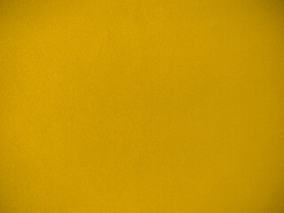 Yellow velvet fabric texture used as background. Empty yellow fabric background of soft and smooth textile material. There is space for text.