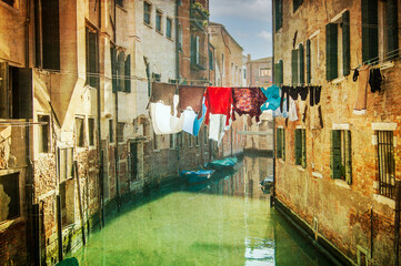 Small canal, the clothes are hanging to dry, with moored boats, old houses and Venetian lagoon, Venice, UNESCO world heritage site, Veneto, Italy, Europe.