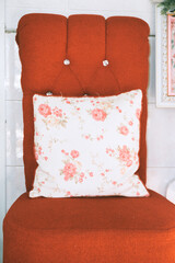 The red chair in the living room makes an attractive interior