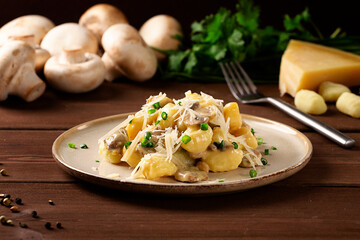Gnocchi with mushrooms, in cream sauce, Italian dish, horizontal, no people, selective focus,