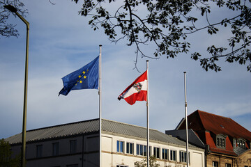 Austrian and European flag at the Austrian Embassy in Berlin - obrazy, fototapety, plakaty