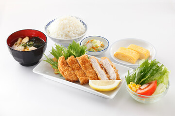 Tonkatsu - Japanese pork cutlet deep fried with rice , miso soup and vegetable salad set - Japanese food set on wooden background.