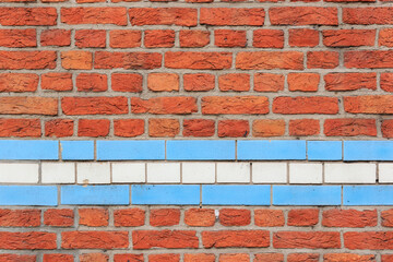 material texture of red brick wall with blue and white lines