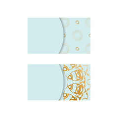 Business card in aquamarine color with Indian gold pattern for your business.