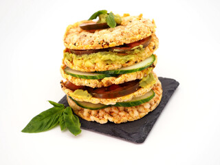 Cornbread sandwich with guacamole, tomatoes and herbs