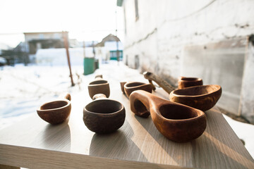 Carpentry workshop, handmade wood products. a set of wooden dishes lies on the table, carpenter work, wood carving