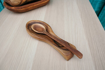 Carpentry workshop, handmade wood products. a set of wooden dishes lies on the table, carpenter work, wood carving