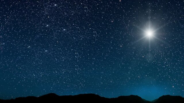 The star shines over the manger of christmas of Jesus Christ.