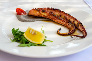 Grilled octopus with olive paste and lemon