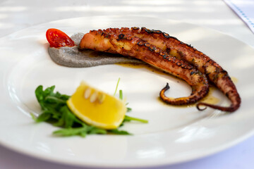 Grilled octopus with olive paste and lemon