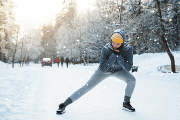 Young athletic woman warming up before her winter workout
