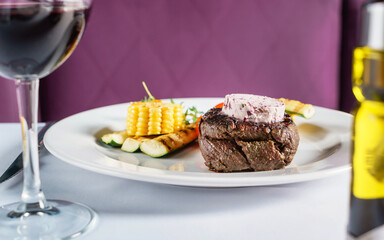 steak with grilled vegetables in restaurant