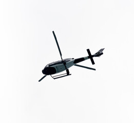Helicopter Flying in the sky on a white background for design as a security concept and surveillance