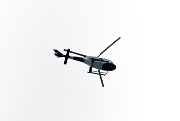 Helicopter Flying in the sky on a white background for design as a security concept and surveillance