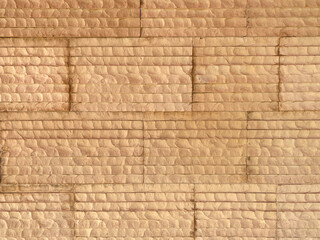 pueblo style brick block wall stone shape blocks natural sand color architectural background