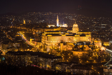 Historic Royal Palace - Buda Castle or Budai Vár close up evening view with lights on from Buda...