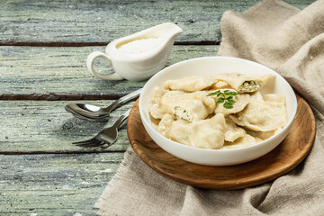 Dumplings with cottage cheese and sour cream