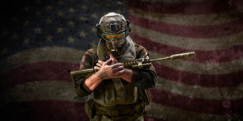 Soldier grieving for the fallen friends against the background of the American flag. Veterans...