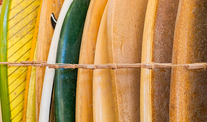 retro vintage surfboards lined up in a local surf shop