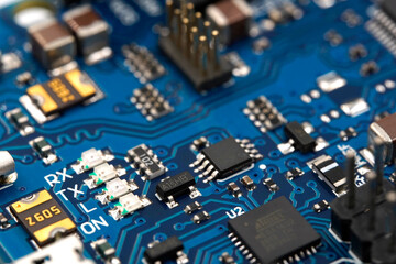 Obraz premium Micro electronics arduino DIY components on a light background, top view, copy space. Microcontrollers, boards, sensors, leds, controllers