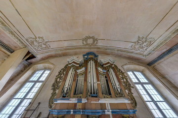  interior dome and looking up into a old gothic catholic  church ceiling with pipe organ