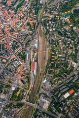 Main train station of Vilnius capital of Lithuania from hot air balloon. View on railways junction from the sky point of view..