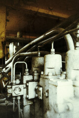 Grungy shot of an excavator hydraulic compressor unit