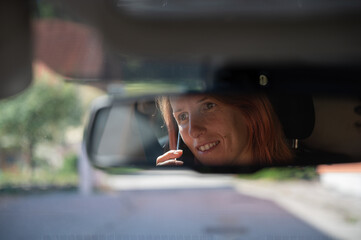 Woman talking on mobile phone while driving