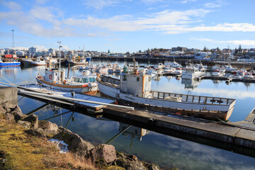 Fototapeta premium Many small fishing boats are in the port at the pier