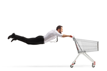 Man flying with an empty shopping cart