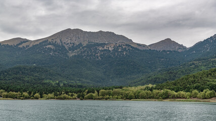 Sharp peaks surround the waters of a mountain lake