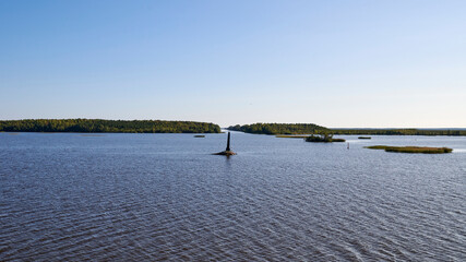 Russia. River Kovzha. Obelisk at the entrance to the Belozersky bypass channel