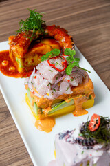 Limeñas Trio of Causes, Cause of Olive Octopus, Cause of Sweet Potato with Octopus, Cause of Spicy Potato with Ceviche
