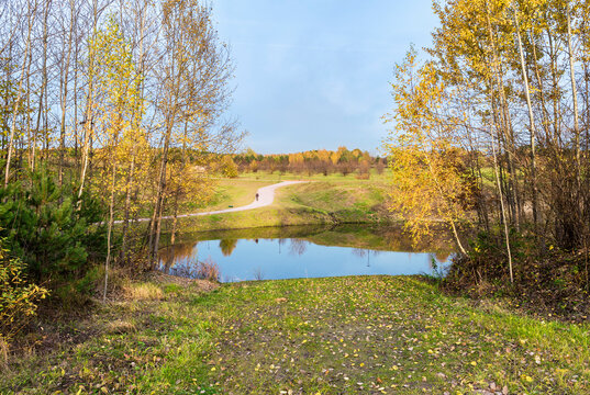 Moscow region. October 12, 2021. Golden autumn landscape in Meshchersky park. Beautiful view of the pond, road and valley.
