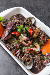 Black shell ceviche, accompanied by onion sarsa and crab with sweet potato.
