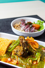 The thickness is a corn and meat stew typical of Peruvian cuisine, accompanied by mackerel ceviche.
