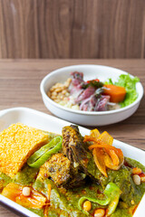 The thickness is a corn and meat stew typical of Peruvian cuisine, accompanied by mackerel ceviche.
