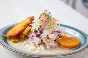 Peruvian eviction, accompanied by sweet potato, chili, corn cake.
