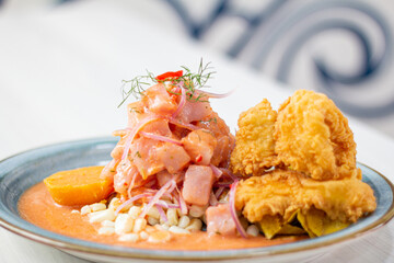 Peruvian eviction, very spicy accompanied by corn, sweet potato and pork rinds with peas.
