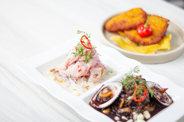 Duo of Peruvian ceviche, black shells and classic fish ceviche.

