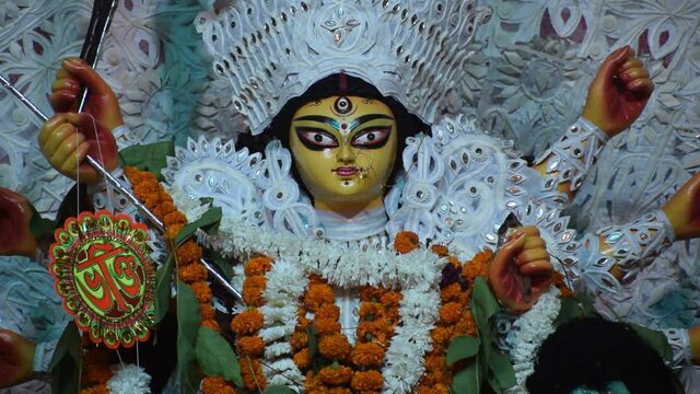 Durga puja or Navratri celebration in Kolkata, West Bengal, India. Dhunachi is a Bengali incense burner used for one of the stages during aarti, or ritualized dance worship