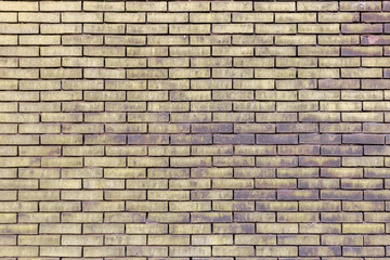 material texture of beige yellow brick wall