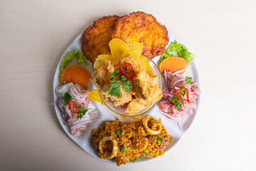 Perfect combo of Peruvian ceviche, with corn cakes and seafood rice.
